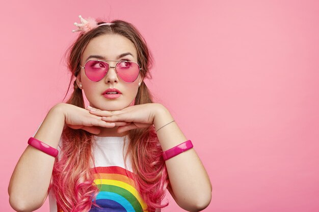 Beautiful woman with trendy pink sunglasses