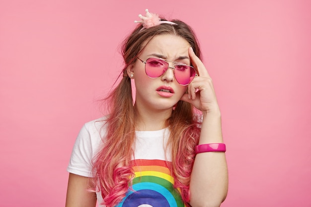 Beautiful woman with trendy pink sunglasses