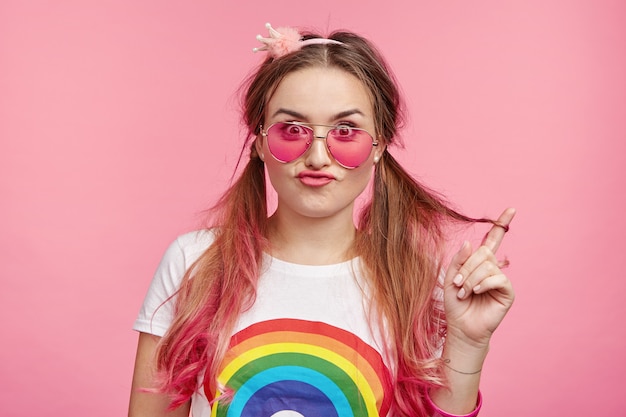 Beautiful woman with trendy pink sunglasses