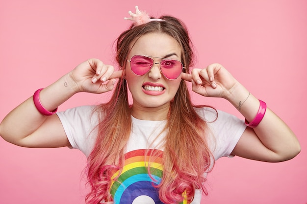 Beautiful woman with trendy pink sunglasses