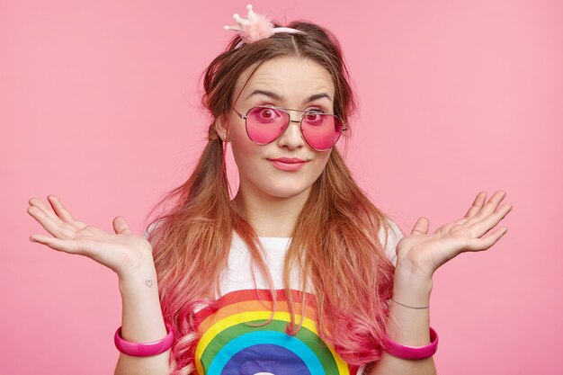 Beautiful woman with trendy pink sunglasses