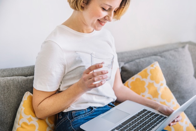 Beautiful woman with woman using laptop