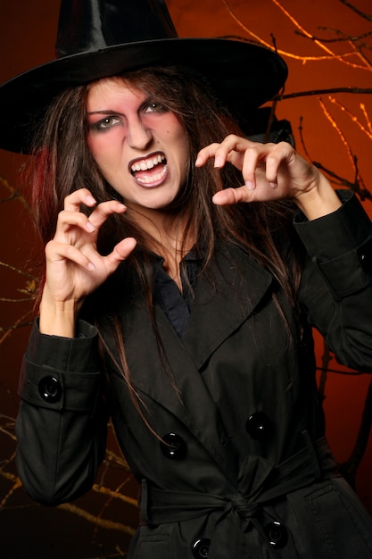 Free photo beautiful woman witha pumpkin in the hands