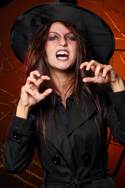 Beautiful woman witha pumpkin in the hands