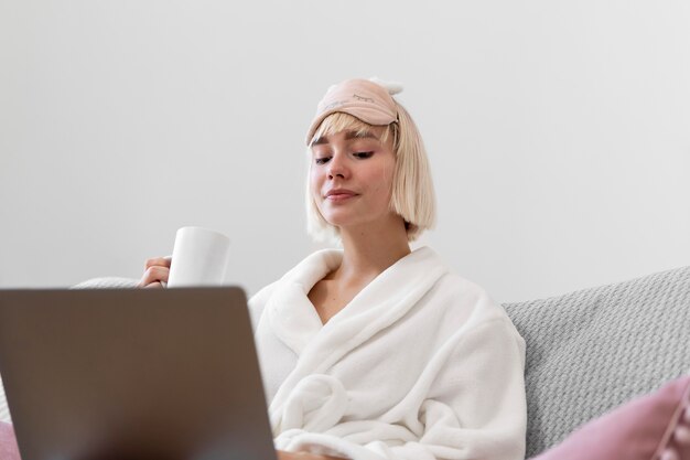 Beautiful woman working after waking up of her sleep