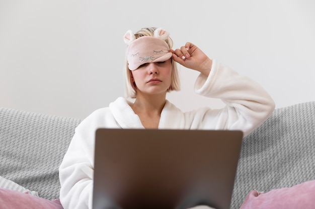 Beautiful woman working after waking up of her sleep