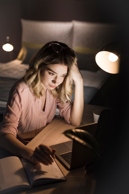 Beautiful woman working late