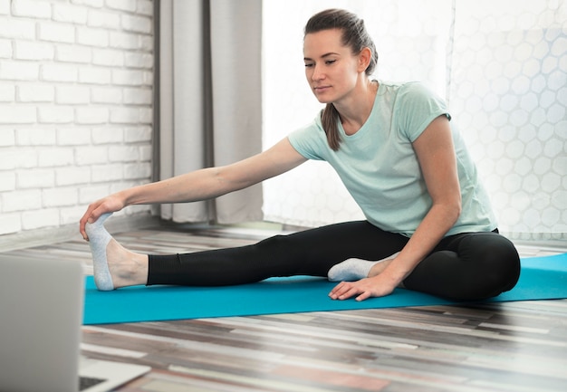 Beautiful woman working out at home