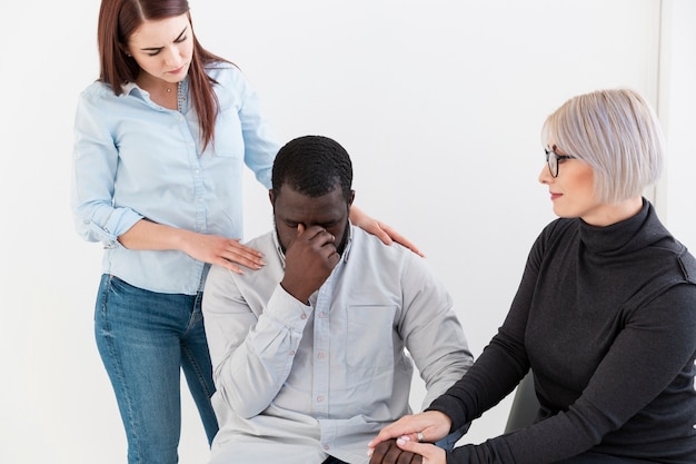 Beautiful women encouraging sad patient