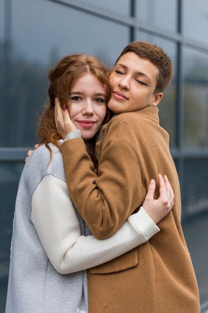 Beautiful women hugging each other