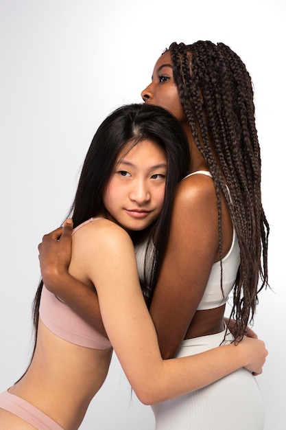 Beautiful women hugging each other