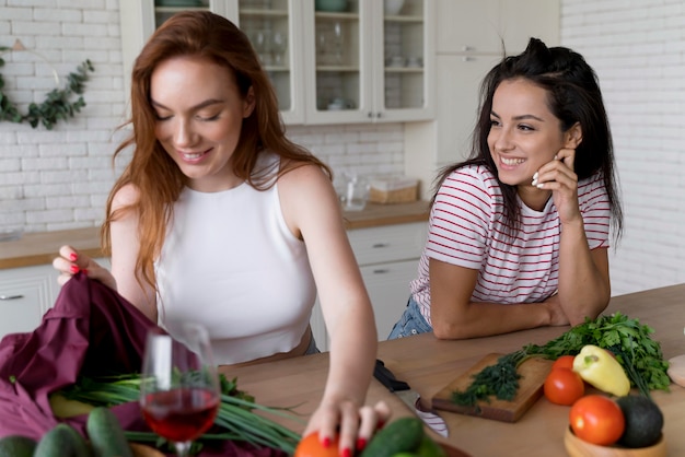 Beautiful women preparing together their dinner