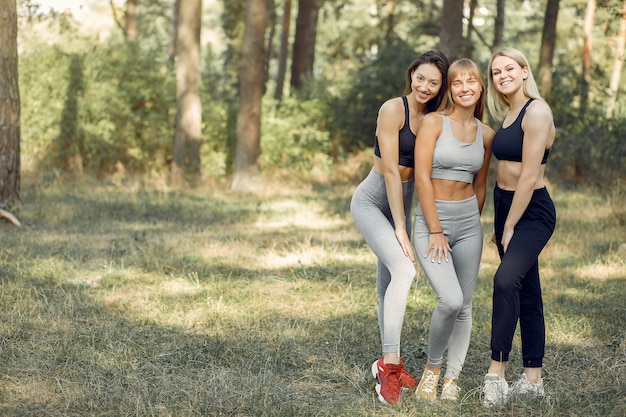 Beautiful women spend time in a summer park