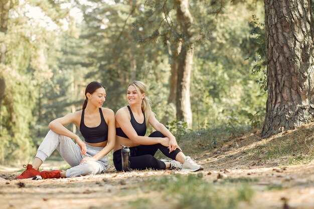 Beautiful women spend time in a summer park