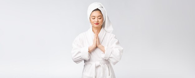 Beautiful women take care of skin health holding hand praying Beautiful girl on white background