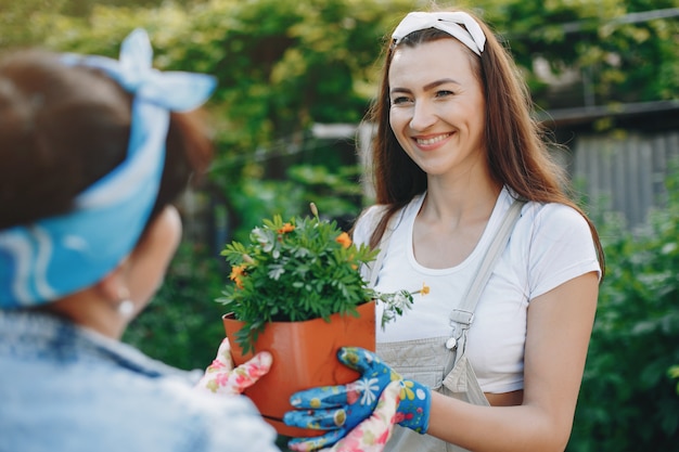 Beautiful women works in a garden 