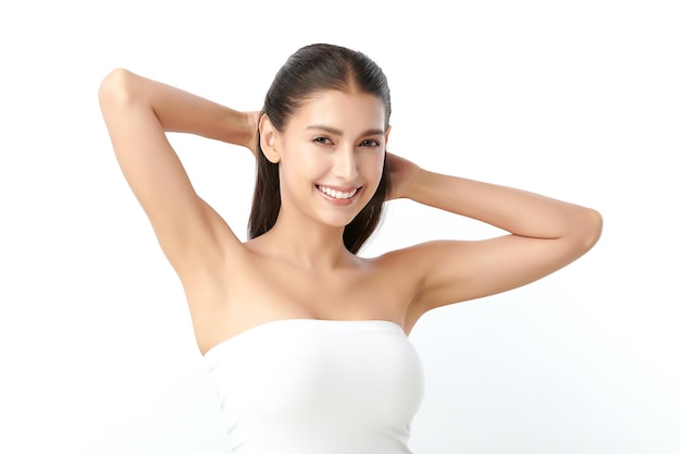 Beautiful young asian woman lifting hands up to show off clean and hygienic armpits or underarms on white background smooth armpit cleanliness and protection concept Premium Photo
