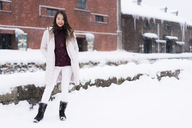 Beautiful young asian woman smile and happy with travel trip in Otaru canal Hokkaido Japan