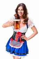 Free photo beautiful young brunette girl in dirndl drinks out of oktoberfest beer stein. isolated on white background.