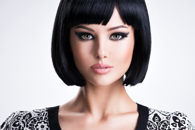 Beautiful young brunette woman with short hairstyle