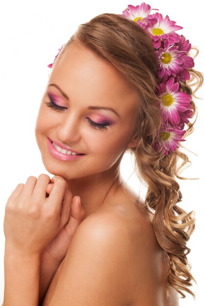 Beautiful young caucasian woman with flowers 