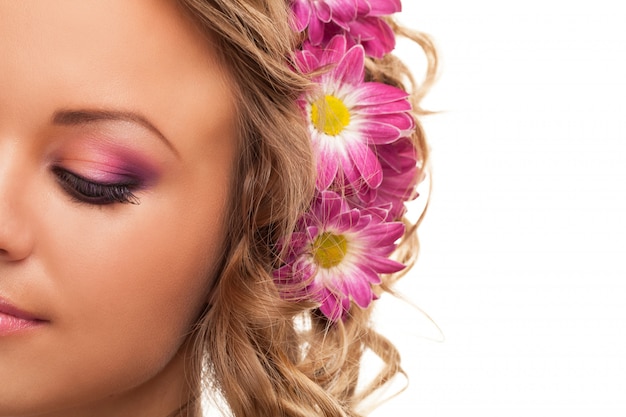 Beautiful young caucasian woman with flowers