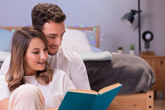 Beautiful young couple in bed