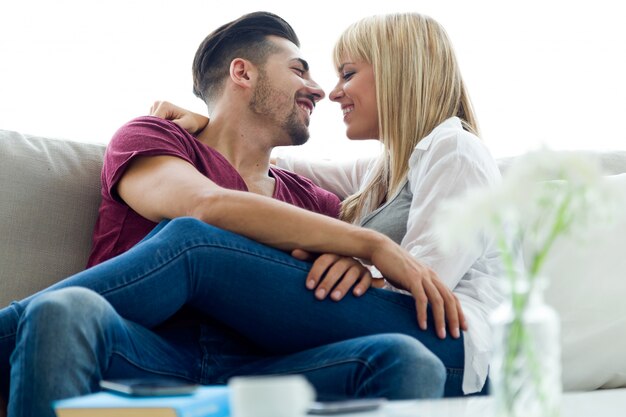 Beautiful young couple in love at home.