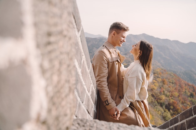 Beautiful young couple showing affection on the Great Wall of China
