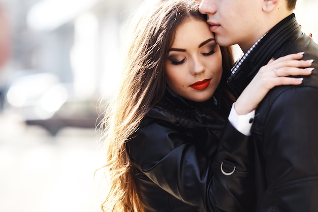 Free photo beautiful young couple tenderly embracing each other