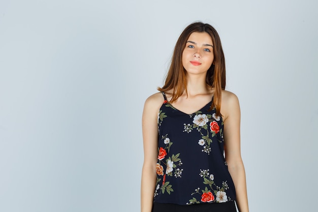 Beautiful Young Female Looking at Camera in Blouse and Looking Charming: Free Stock Photos