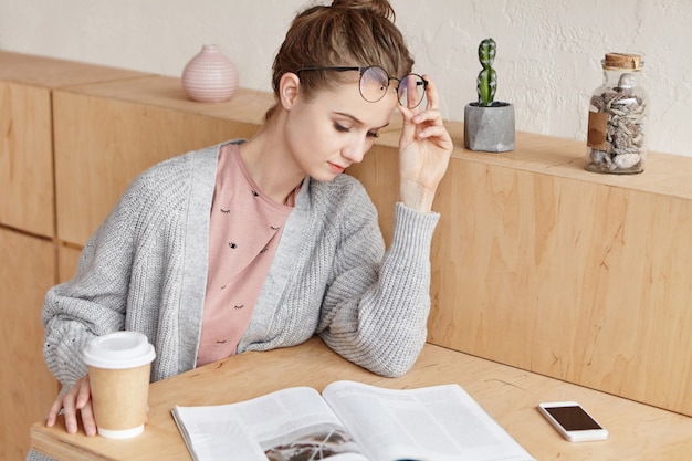 Beautiful young female studying at home