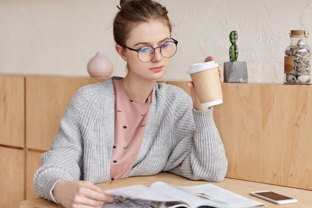 Beautiful young female with cup of coffee