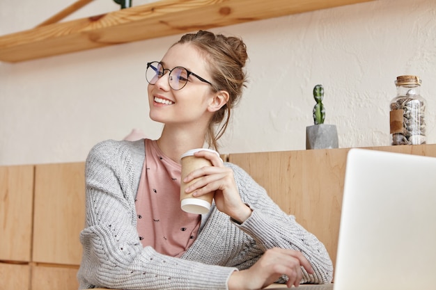 Beautiful young female working with laptop