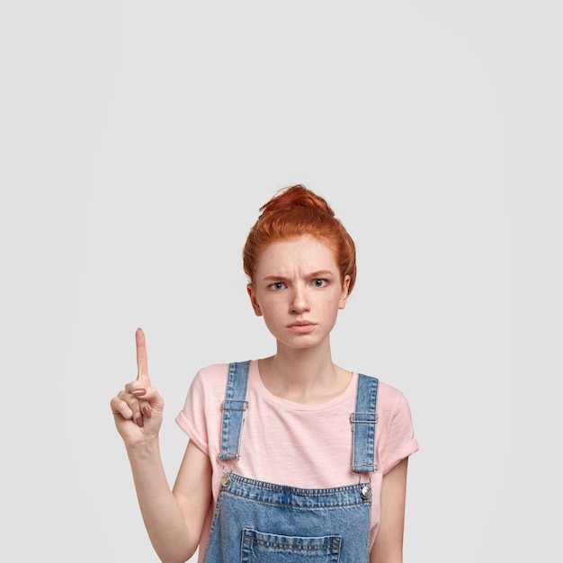 Free photo beautiful young ginger female teacher being stern