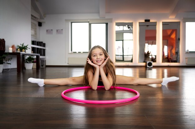 beautiful young girl using hula hop