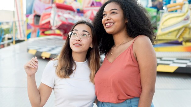 Beautiful young girls together outdoors