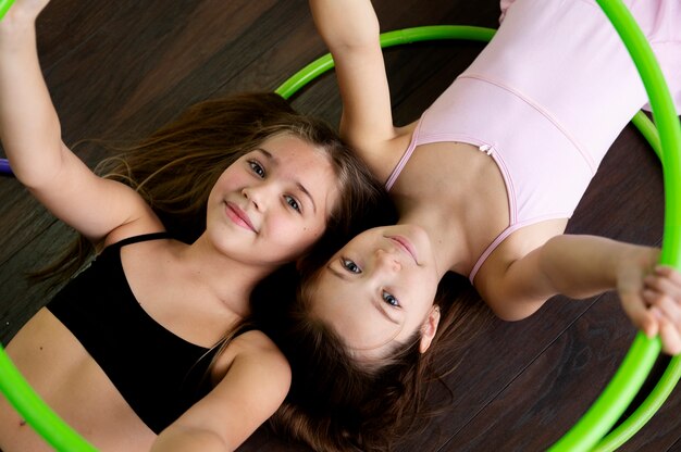 beautiful young girls using hula hop