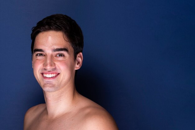 Beautiful young male smiling at camera