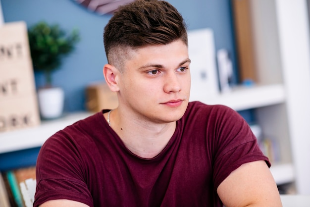 Beautiful young man looking away