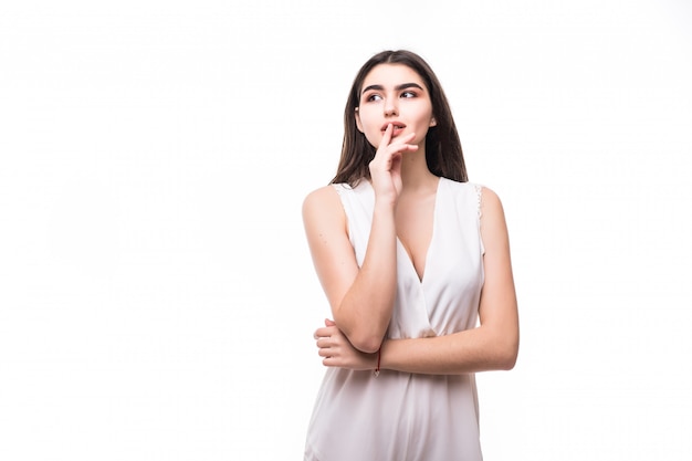 Beautiful young model in modern white dress on white thinking