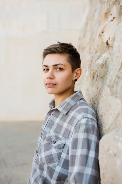 Beautiful young person in shirt on street