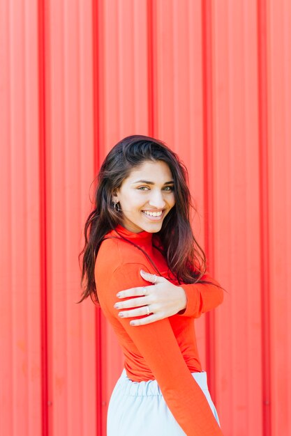 Beautiful young smiling woman looking at camera 