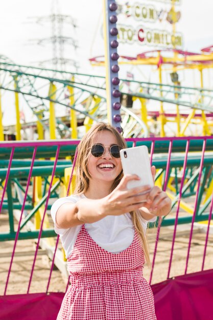 Beautiful young woman in the amusement park