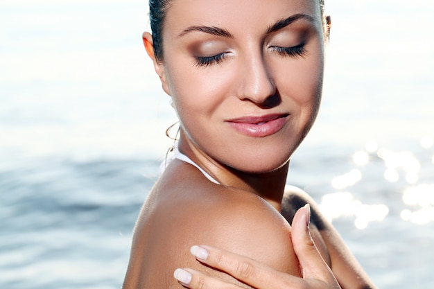 Beautiful young woman in the beach