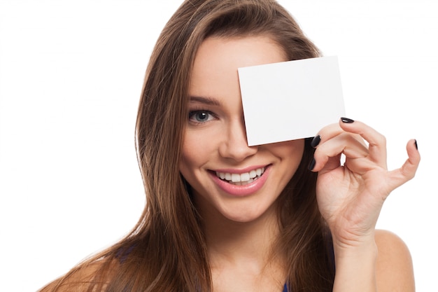 Free photo beautiful young woman close eyes with card