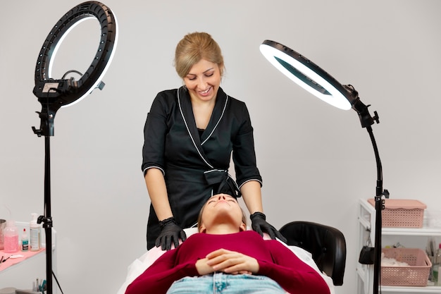 Beautiful young woman going through a microblading treatment