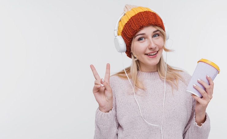 Free Photo beautiful young woman listening to music