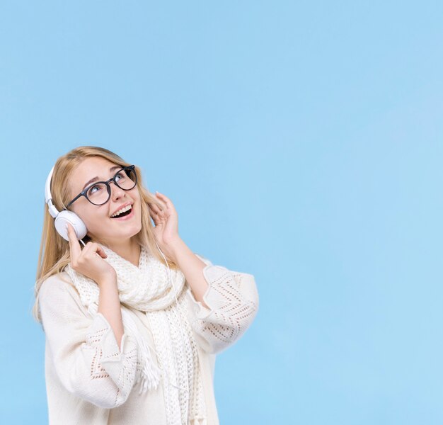 Beautiful young woman listening to music