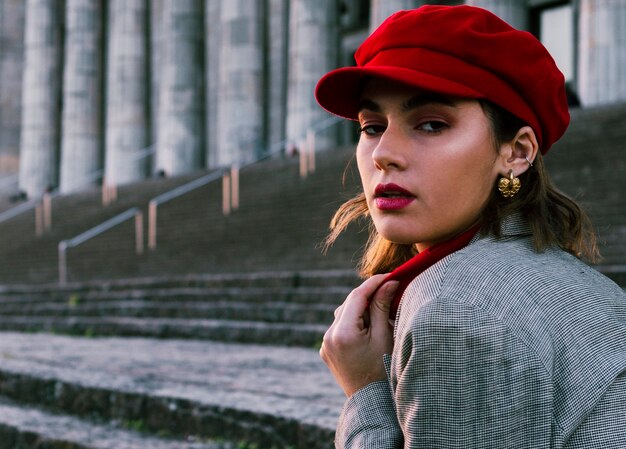 Beautiful young woman looking over shoulder